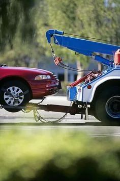 Recovery truck lifting a car onto a tow hook